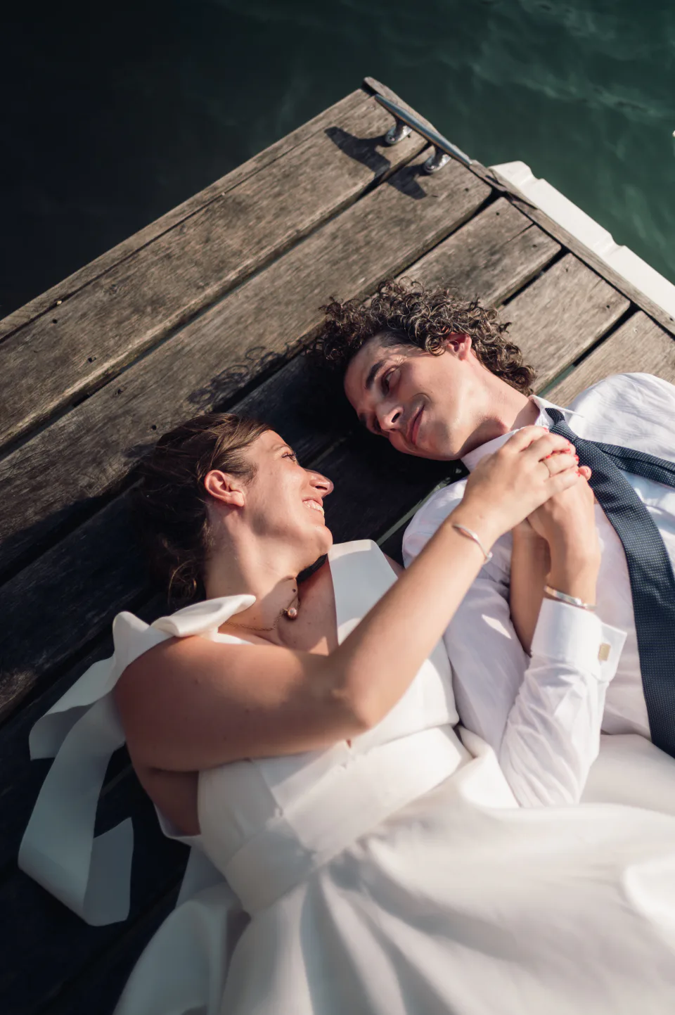 Newlyweds beside a lake